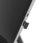 Small black USB dongle clipped to the side of a computer monitor.