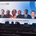 Group of diverse speakers on a stage at ID Africa 2026, banner reads 'Cybersecurity for Digital Identity'.